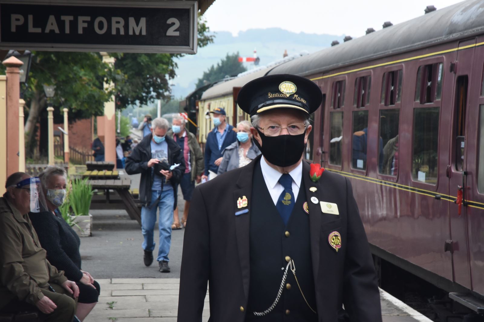 Train guard wearing mask at GWSR